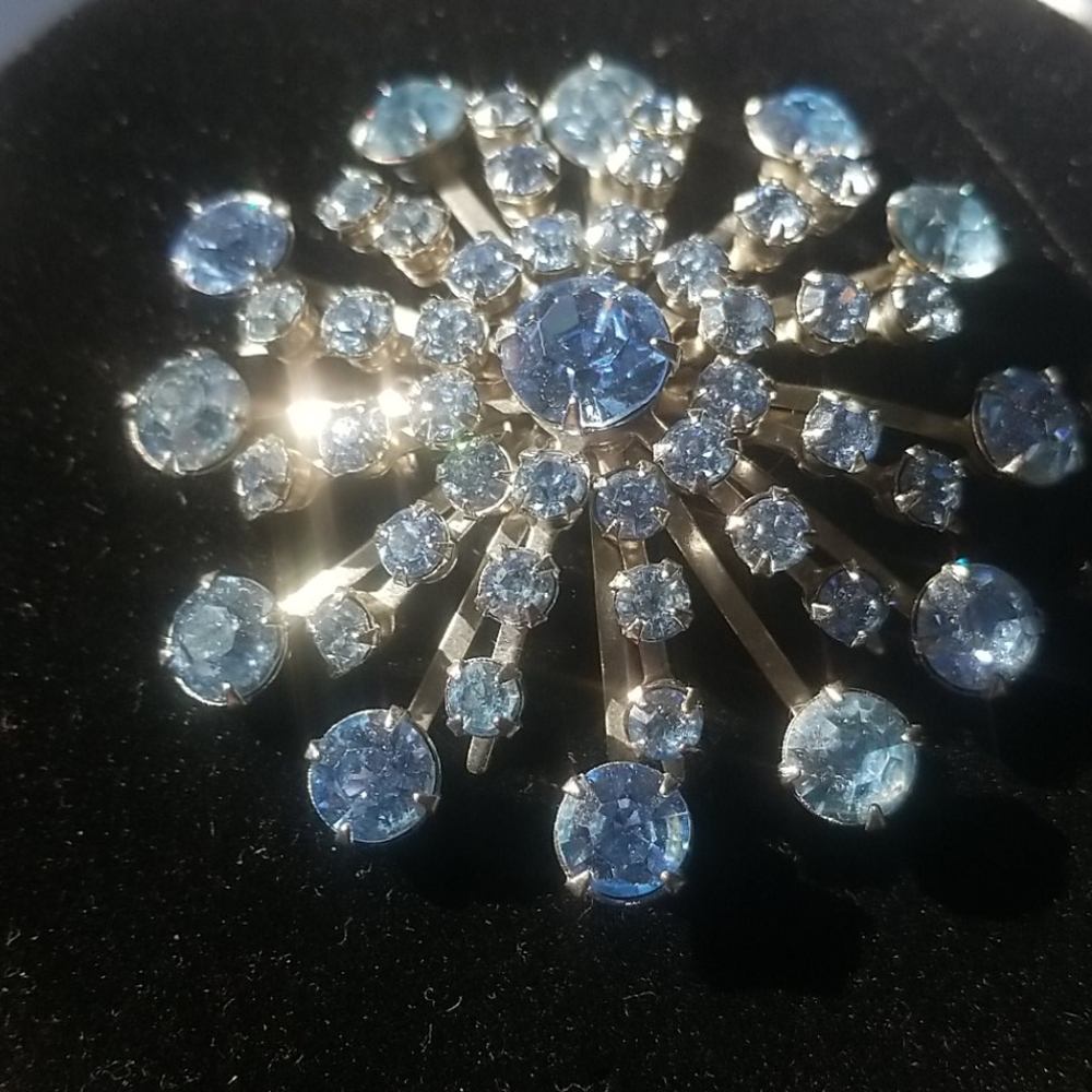 Baby blue rhinstone brooch in silver tone setting